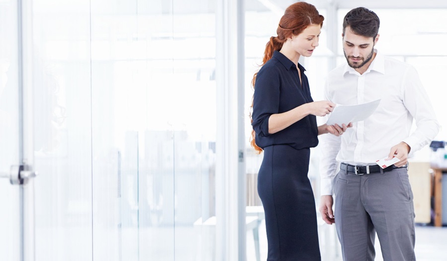 man and woman in office