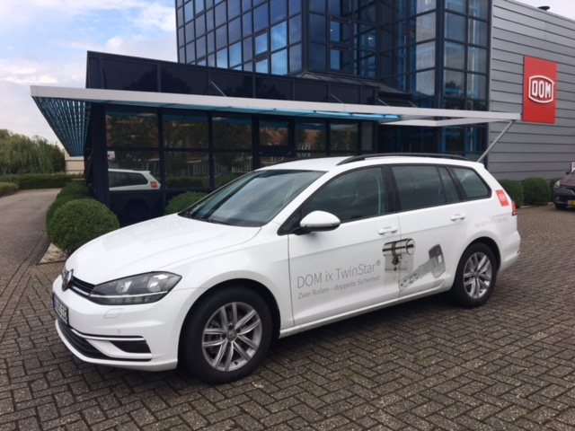 company car wrapped with DOM branding