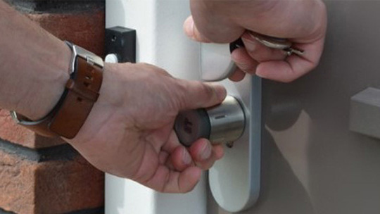 homeowner using the DOM Tapkey