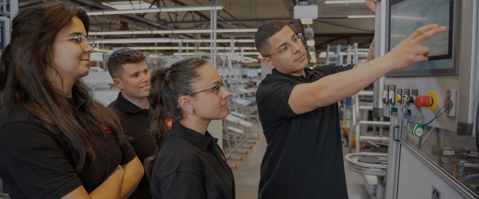 Apprentices at DOM Security learning to use modern production technology.