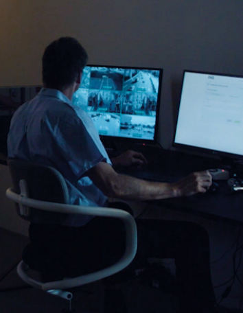 man behind a computer screen