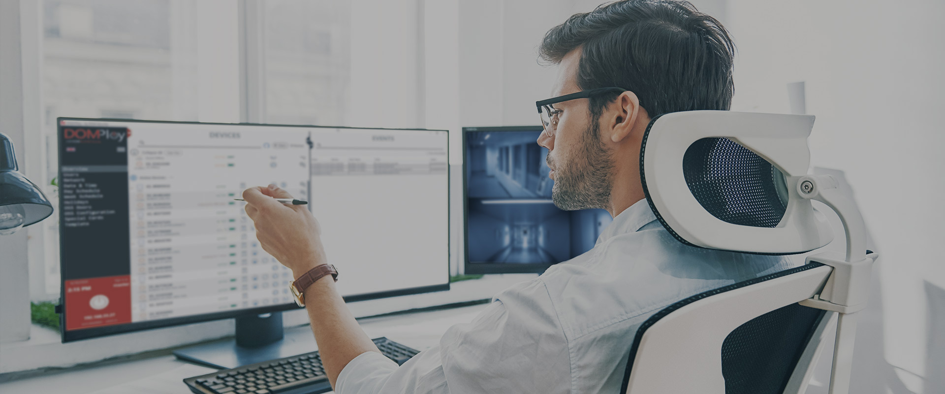 man looking at computer with interface of DOMPloy