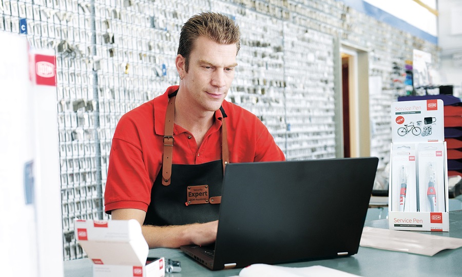locksmith working on his laptop
