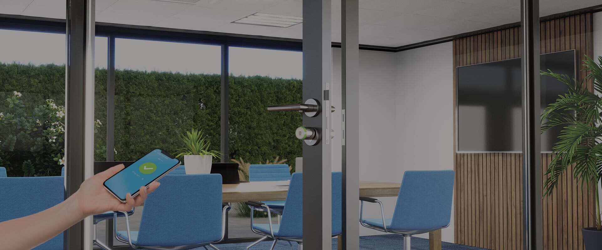 hand opening an office door protected by a DOM Tapkey access control device via smartphone