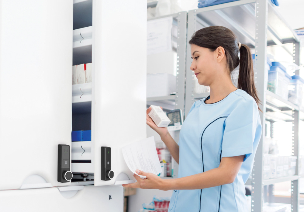 Woman opening medicine cabinet with ENiQ LoQ