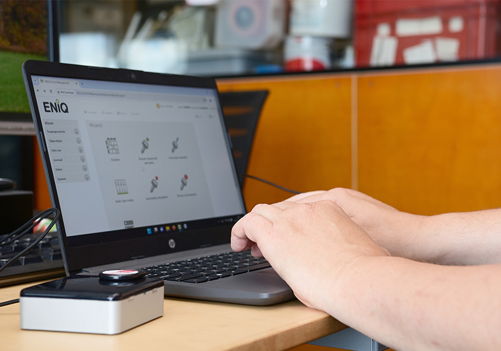 DOM ENiQ software interface on laptop